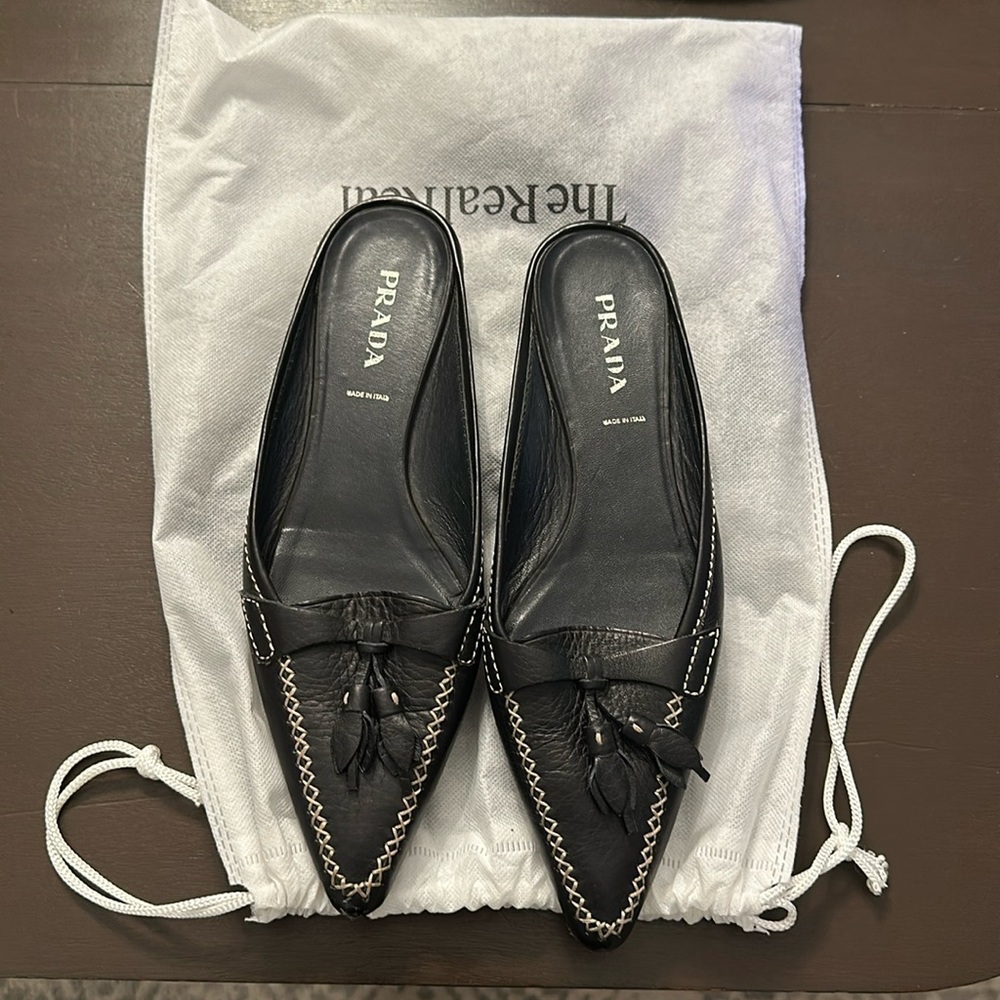 Selling a pair of Prada shoes, size 39, good condition.